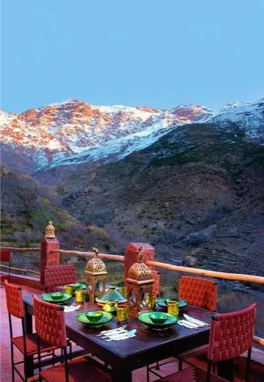 A long table set for a Berber lunch above the valley