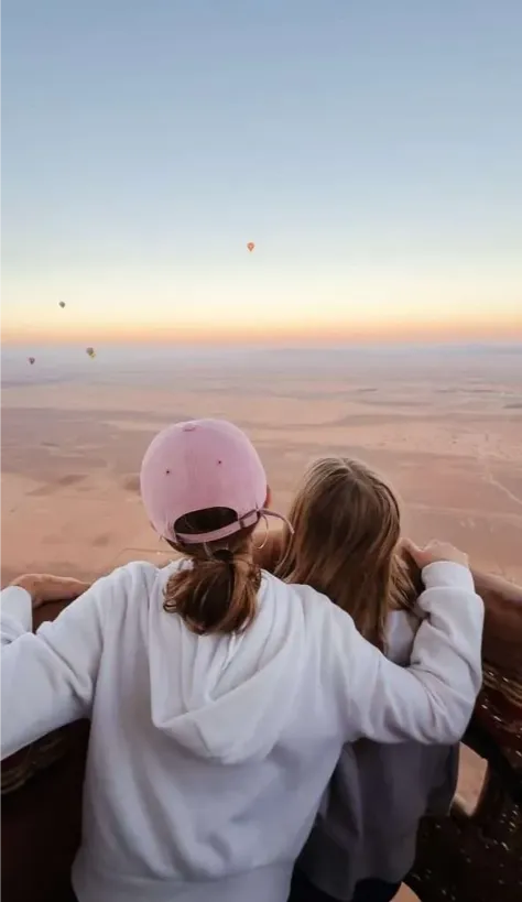 A family at a luxury Sahara camp under the desert sky